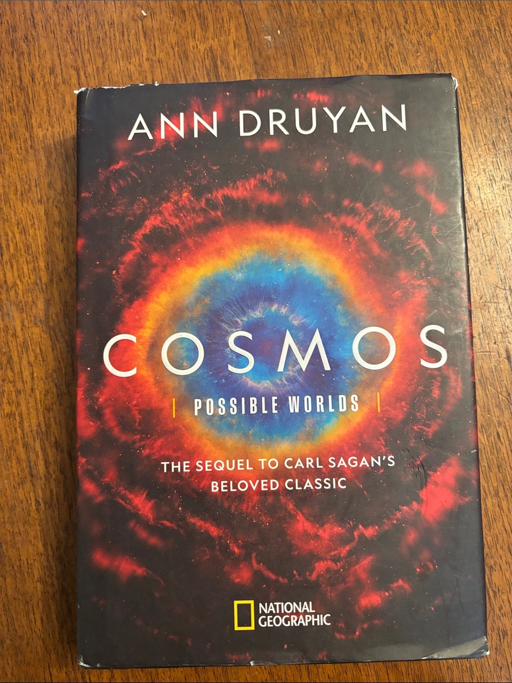 National Geographic Cosmos Hardcover with Vibrant Red and Blue Cover